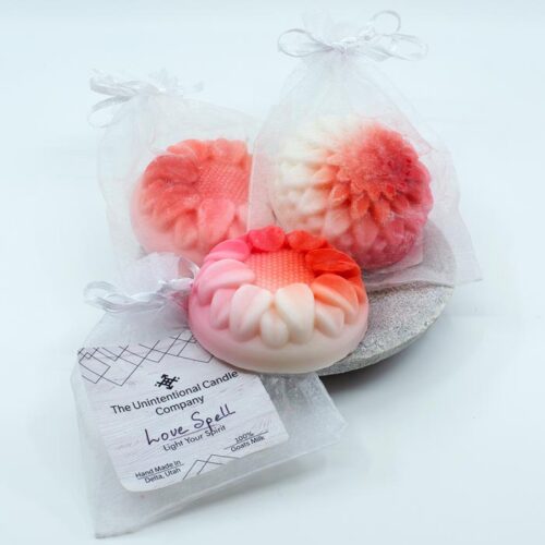 Guest-size cakes of goat milk soap in decorative shapes